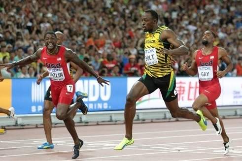 WORLD'S GREATEST Bolt defies odds to win third 100 title