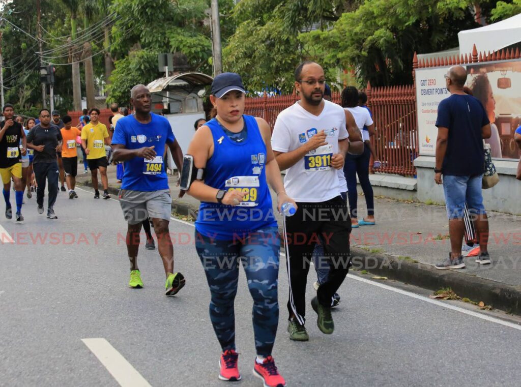 Cross Country & Road Race : Newsday's Jelani Beckles (white) RBC Race for the Kids, Queen's Park Savannah, POS
